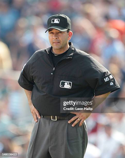 Major League Umpire Angel Campos watches the action prior to the start of the game between the Minnesota Twins and the Detroit Tigers at Comerica...