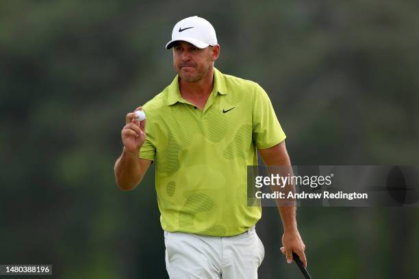 Brooks Koepka of the United States reacts to his birdie on the 18th green during the first round of the 2023 Masters Tournament at Augusta National...