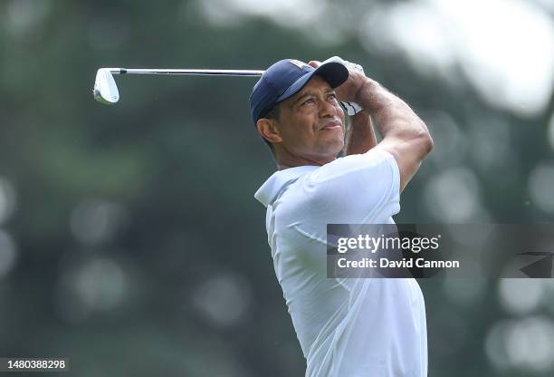 Tiger Woods of The United States plays his tee shot on the fourth hole during the first round of the 2023 Masters Tournament at Augusta National Golf...