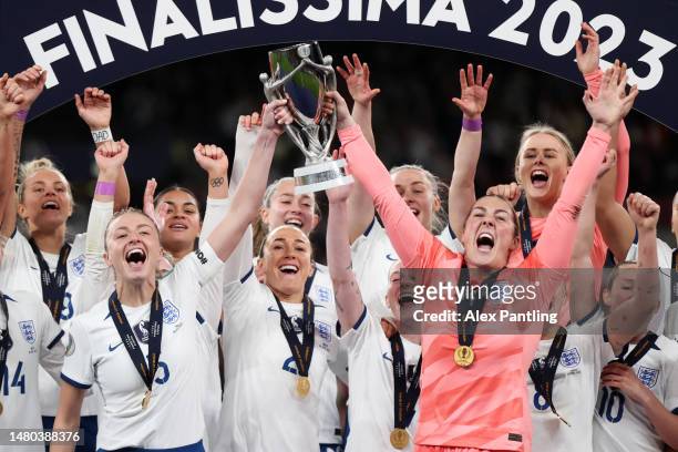 Leah Williamson and Mary Earps of England lift the Women's Finalissima trophy after the team's victory during the Women´s Finalissima 2023 match...