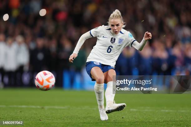 Alex Greenwood of England scores the team's fourth penalty in the penalty shoot out during the Women´s Finalissima 2023 match between England and...
