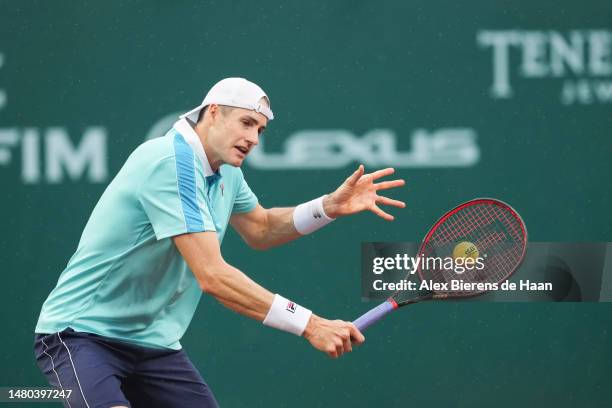 John Isner of the United States returns a shot against Gijs Brouwer of The Netherlands during their second round matchup at the U.S. Men’s Clay Court...