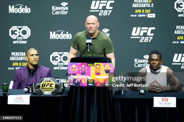 President Dana White is flanked by Alex Pereira of Brazil and Israel Adesanya of Nigeria on stage during the UFC 287 press conference at Miami-Dade...