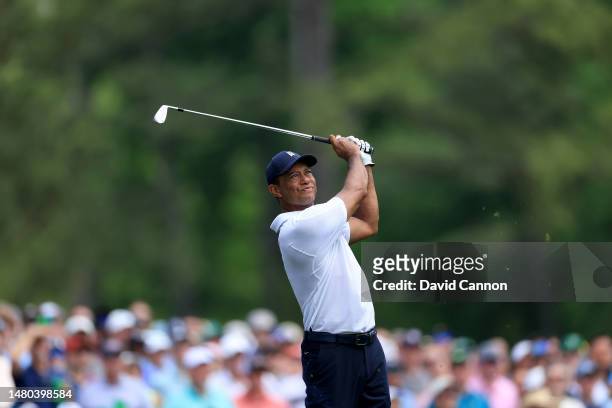 Tiger Woods of The United States plays his tee shot on the 12th hole during the first round of the 2023 Masters Tournament at Augusta National Golf...