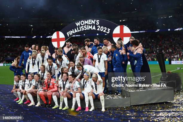 Players of England celebrate with the Women's Finalissima trophy after the team's victory in the Women´s Finalissima 2023 match between England and...