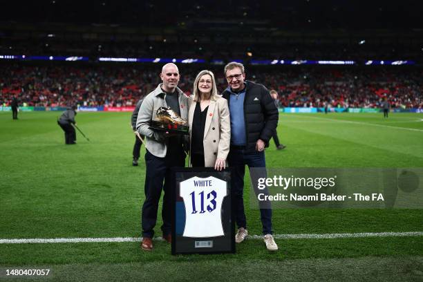 Ellen White, former England players poses for a photo with a Golden Boot award and commemorative shirt as England Women's all time leading goal...