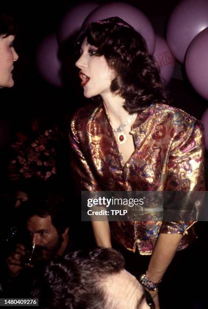 American actress and model Marisa Berenson talks to an unidentified woman at the nightclub, Studio 54 in New York, New York, circa 1977.