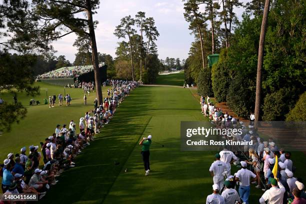 Scottie Scheffler of the United States plays his shot from the 18th tee during the first round of the 2023 Masters Tournament at Augusta National...