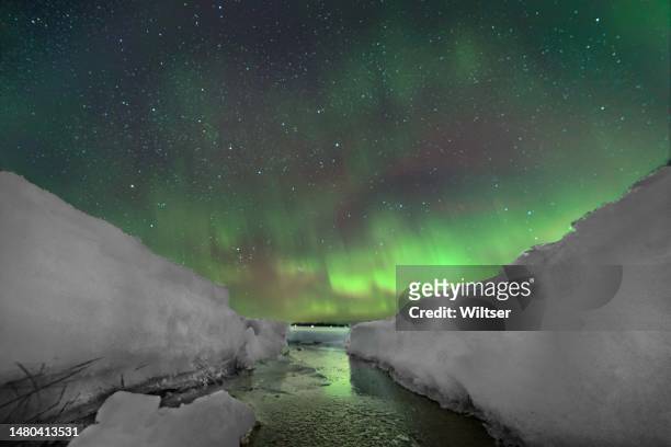 northern lights  in the ice crack - northern lights michigan bildbanksfoton och bilder