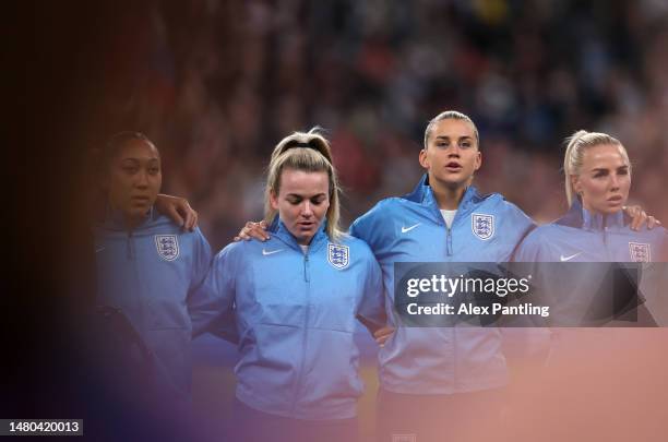 Lauren Hemp, Alessia Russo and Alex Greenwood of England sing their national anthem during the Women´s Finalissima 2023 match between England and...