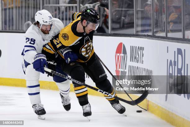 Brodie of the Toronto Maple Leafs defends Garnet Hathaway of the Boston Bruins during the third period at TD Garden on April 06, 2023 in Boston,...