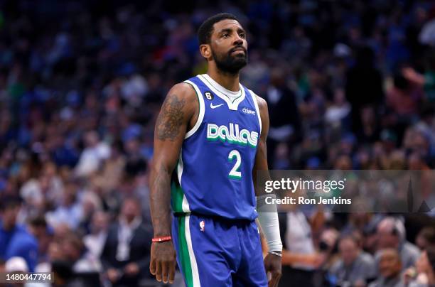 Kyrie Irving of the Dallas Mavericks looks on as the Mavericks play the Sacramento Kings in the first half at American Airlines Center on April 5,...