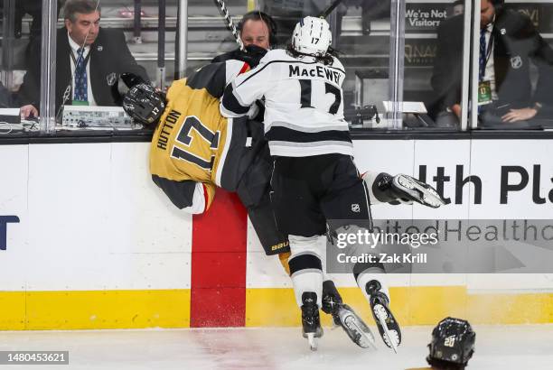 Zack MacEwen of the Los Angeles Kings takes a boarding penalty for a hit against Ben Hutton of the Vegas Golden Knights during the first period at...