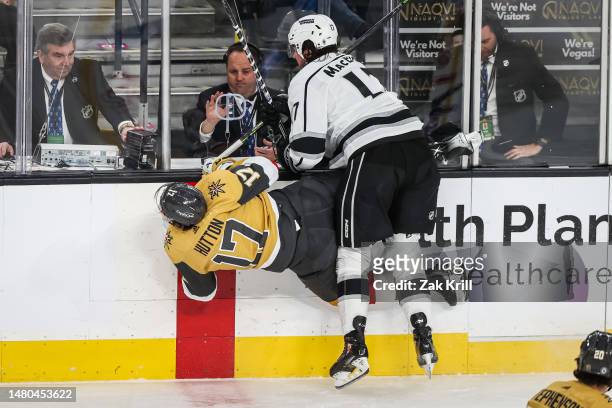 Zack MacEwen of the Los Angeles Kings takes a boarding penalty for a hit against Ben Hutton of the Vegas Golden Knights during the first period at...