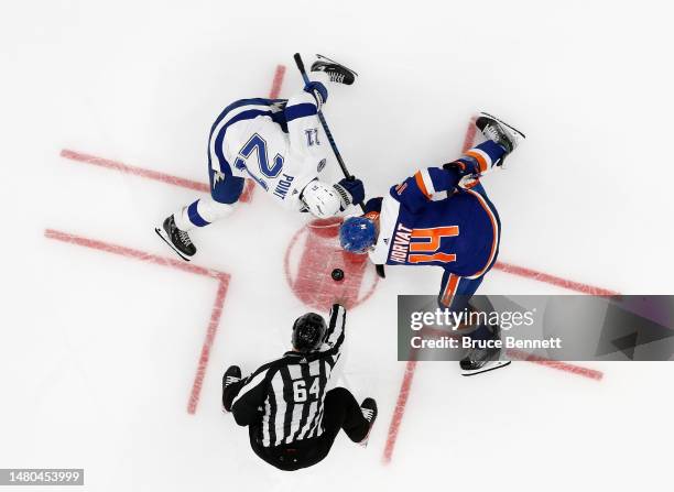 Brayden Point of the Tampa Bay Lightning takes the faceoff against Bo Horvat of the New York Islanders at the UBS Arena on April 06, 2023 in Elmont,...