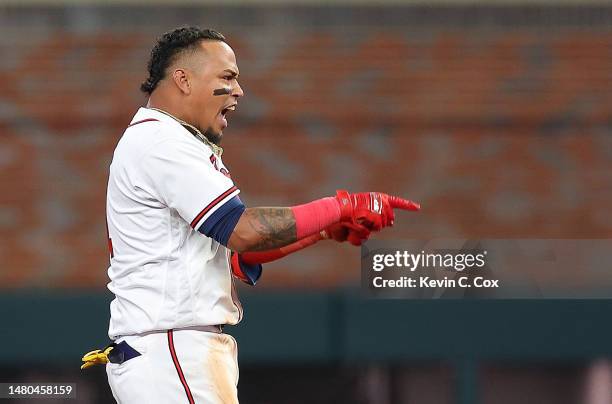 Orlando Arcia of the Atlanta Braves celebrates hitting a walk-off single in the ninth inning against the San Diego Padres at Truist Park on April 06,...