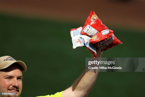 Vendor sells seeds and nuts during the game between the Miami Marlins and Milwaukee Brewers at Miller Park on July 04, 2012 in Milwaukee, Wisconsin.