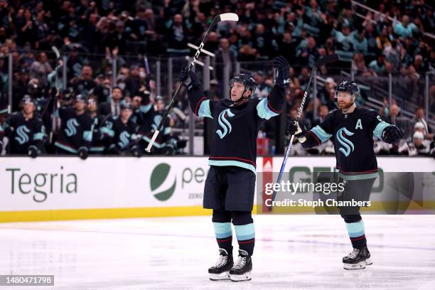 Vince Dunn celebrates his goal with Adam Larsson of the Seattle Kraken during the second period against the Arizona Coyotes at Climate Pledge Arena...