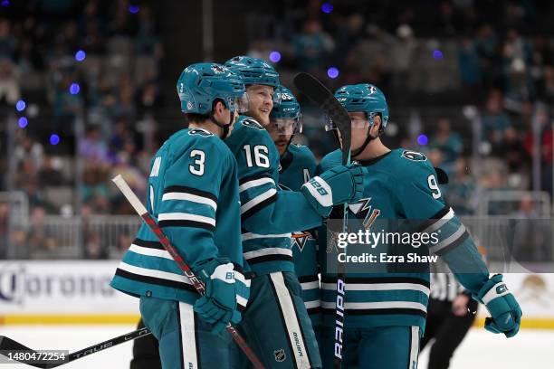 Steven Lorentz of the San Jose Sharks is congratulated by Henry Thrun, Erik Karlsson, and Jacob MacDonald of the San Jose Sharks after Lorentz scored...