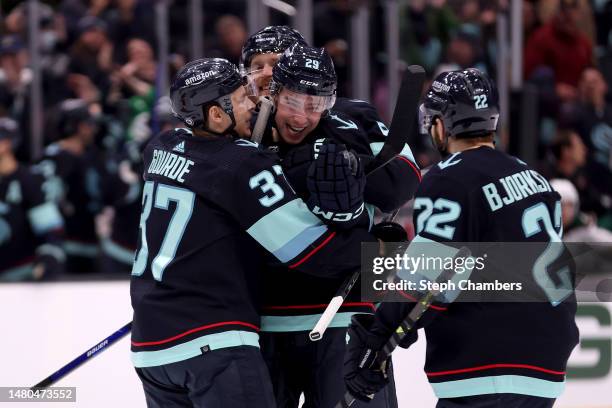 Vince Dunn of the Seattle Kraken celebrates his goal with Yanni Gourde, Adam Larsson and Oliver Bjorkstrand during the second period against the...