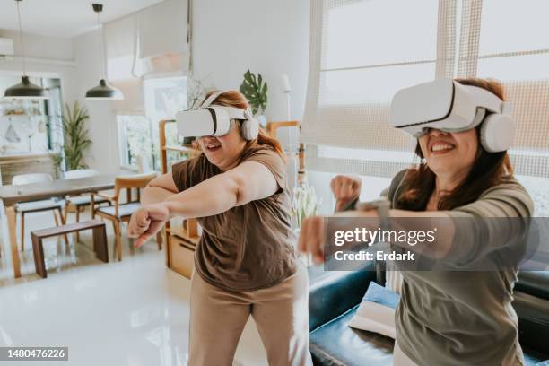 easy exercise at home by playing boxing  game with vr camera. - fight for life stock pictures, royalty-free photos & images