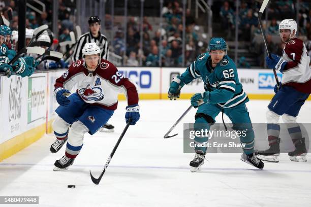 Nathan MacKinnon of the Colorado Avalanche skates past Kevin Labanc of the San Jose Sharks in the third period at SAP Center on April 06, 2023 in San...