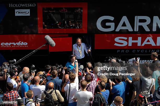 Jonathan Vaughters, CEO of Slipstream Sports and director of Garmin-Sharp, is surrounded by the media as he delivers a statment prior the start of...