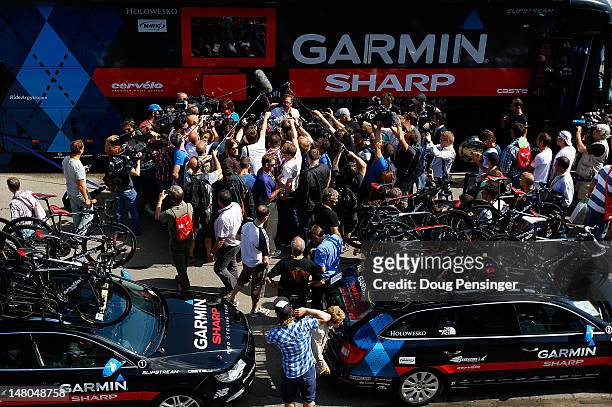 Jonathan Vaughters, CEO of Slipstream Sports and director of Garmin-Sharp, is surrounded by the media as he delivers a statment prior the start of...