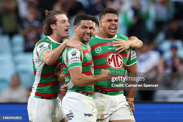 Latrell Mitchell of the Rabbitohs celebrates scoring a try with Cody Walker of the Rabbitohs and team mates during the round six NRL match between...