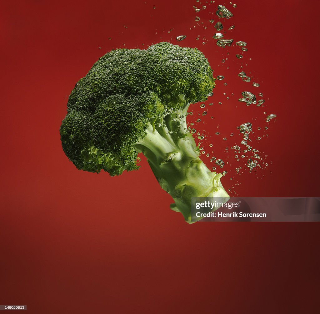 Broccoli splashed into water