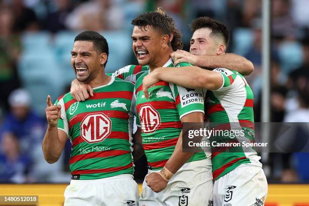 Latrell Mitchell of the Rabbitohs celebrates scoring a try with Cody Walker of the Rabbitohs and team mates during the round six NRL match between...