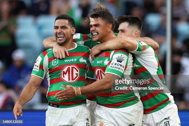 Latrell Mitchell of the Rabbitohs celebrates scoring a try with Cody Walker of the Rabbitohs and team mates during the round six NRL match between...