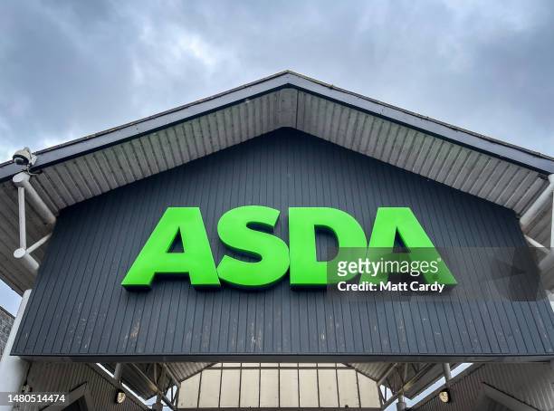 The Asda logo is displayed outside a branch of the supermarket retailer Asda on March 31, 2023 in Taunton, England.The British retailer, founded in...