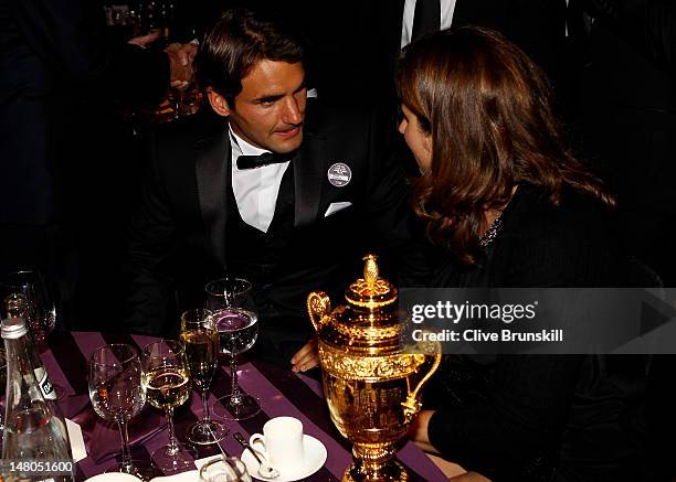 Seven time Wimbledon Men's Champion Roger Federer and his wife Mirka Federer attend the Wimbledon Championships 2012 Winners Ball at the...