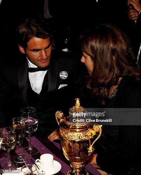 Seven time Wimbledon Men's Champion Roger Federer and his wife Mirka Federer attend the Wimbledon Championships 2012 Winners Ball at the...