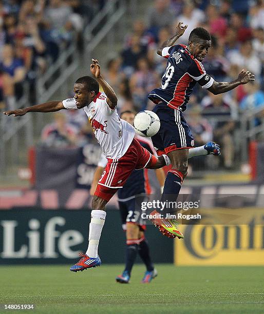 Clyde Simms of the New England Revolution battles Dane Richards of the New York Red Bulls for control of the ball in the second half at Gillette...