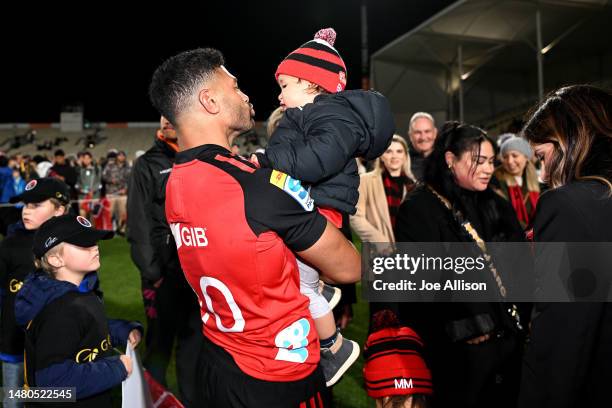 Richie Mo'unga of the Crusaders celebrates with his son Marley after playing his 100th super rugby match during the round seven Super Rugby Pacific...