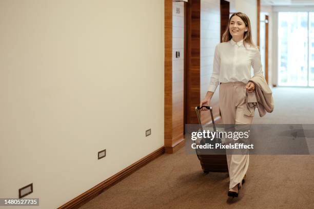 in pursuit of success - hotel hallway stock pictures, royalty-free photos & images