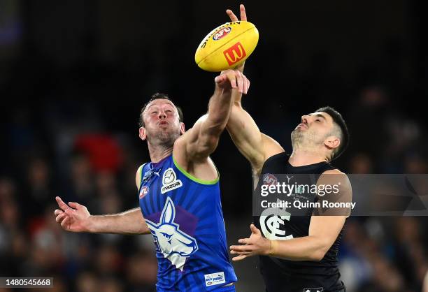 Todd Goldstein of the Kangaroos and Marc Pittonet of the Blues compete in the ruck during the round four AFL match between North Melbourne Kangaroos...