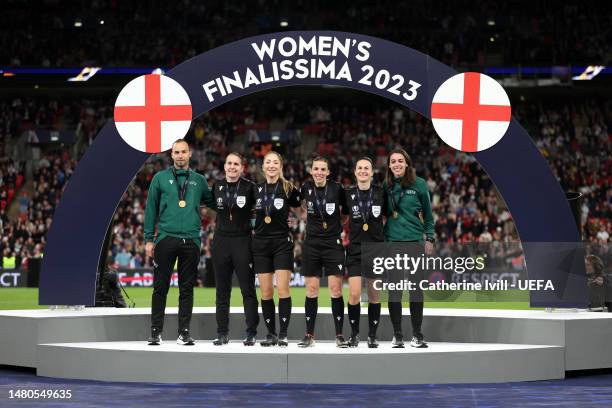 Match officials Jerome Brisard, Elodie Coppola, Manuela Nicolosi, Stephanie Frappart, Esther Staubli and Maika Vanderstichel pose for a photo after...