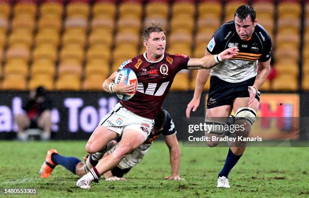 Tate McDermott of the Reds breaks through the defence during the round seven Super Rugby Pacific match between Queensland Reds and ACT Brumbies at...