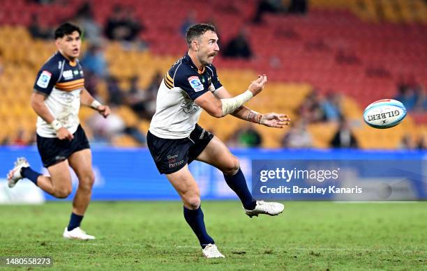 Nic White of the Brumbies passes the ball during the round seven Super Rugby Pacific match between Queensland Reds and ACT Brumbies at Suncorp...