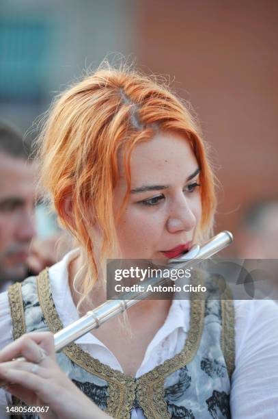 woman playing flute takes part in the religious festival "sagra delle regne" in minturno, lazio, italy. - traditional italian dress stock pictures, royalty-free photos & images