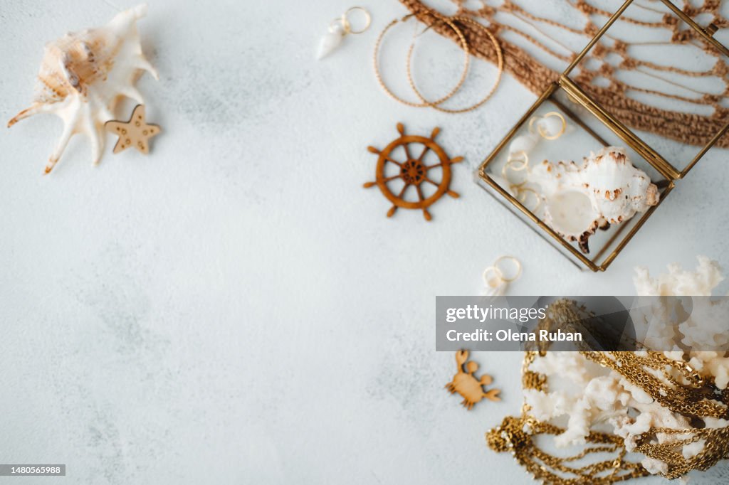 Sea shells, coral decoration, jewelry, toys and a net.