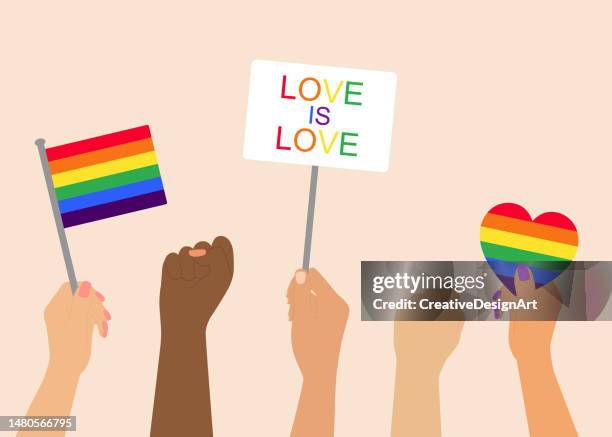 stockillustraties, clipart, cartoons en iconen met hands holding lgbt rainbow flag and placards during pride month celebration. human rights and gender equality concept - gendergelijkheid