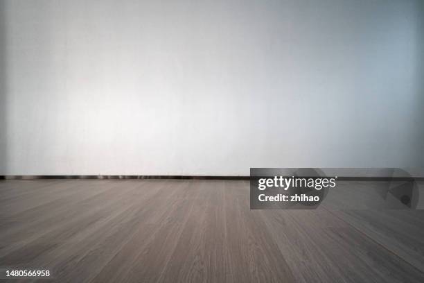 front view of wall and wood floor - hardwood floor stock pictures, royalty-free photos & images