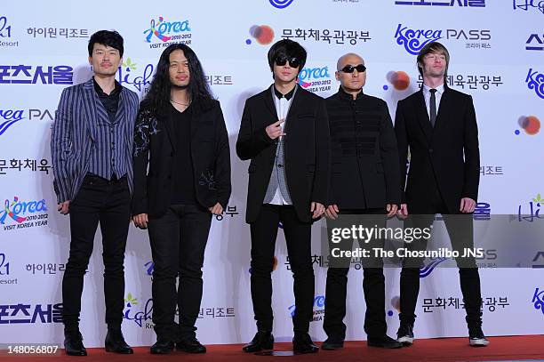 Pose for photographs upon arrival during 21ST High 1 Seoul Music Awards at Olympic Gymnastics Stadium on January 19, 2012 in Seoul, South Korea.