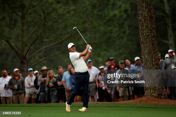 Brooks Koepka of the United States plays a shot on the first hole during the second round of the 2023 Masters Tournament at Augusta National Golf...