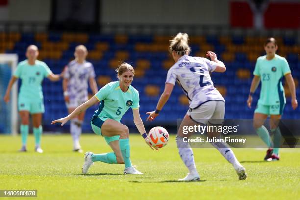 Cortnee Vine of Australia battles for possession with Nicola Docherty of Scotland during the Women's International Friendly match between Australia...