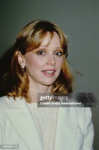 American actress, comedian and singer Shelley Long wearing a white jacket over a white sweater, with a pearl necklace and pearl earrings, United...